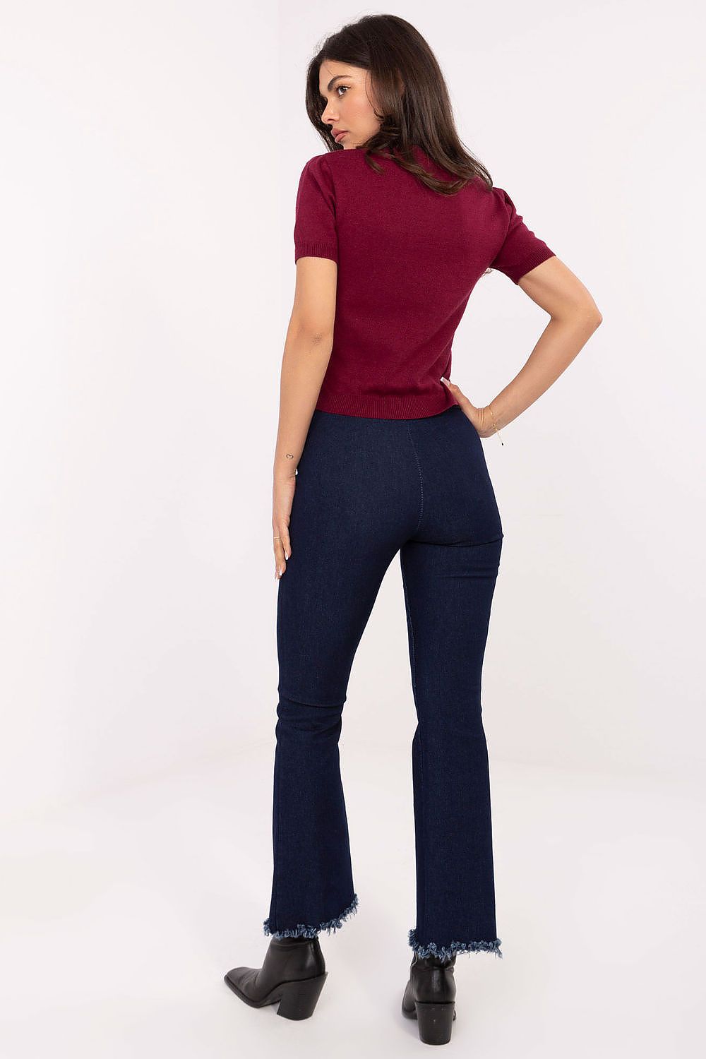 High-quality Italy Moda Bell-Bottom Jeans featuring a flattering high waist and chic frayed hems for a luxury casual look.
