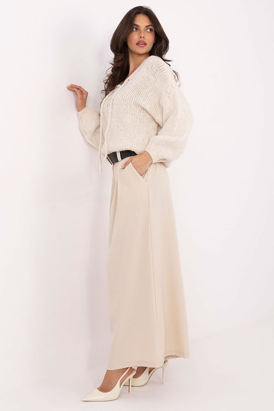 Stylish palazzo pants by Italy Moda, featuring a comfortable elastic high waist, front pleats, and adjustable belt, perfect for both casual and formal occasions.