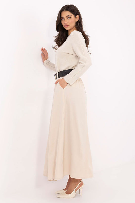 Model wearing the sophisticated long flared maxi skirt with elastic waistband by Italy Moda, featuring functional side pockets and exquisite front godets for an elegant silhouette.