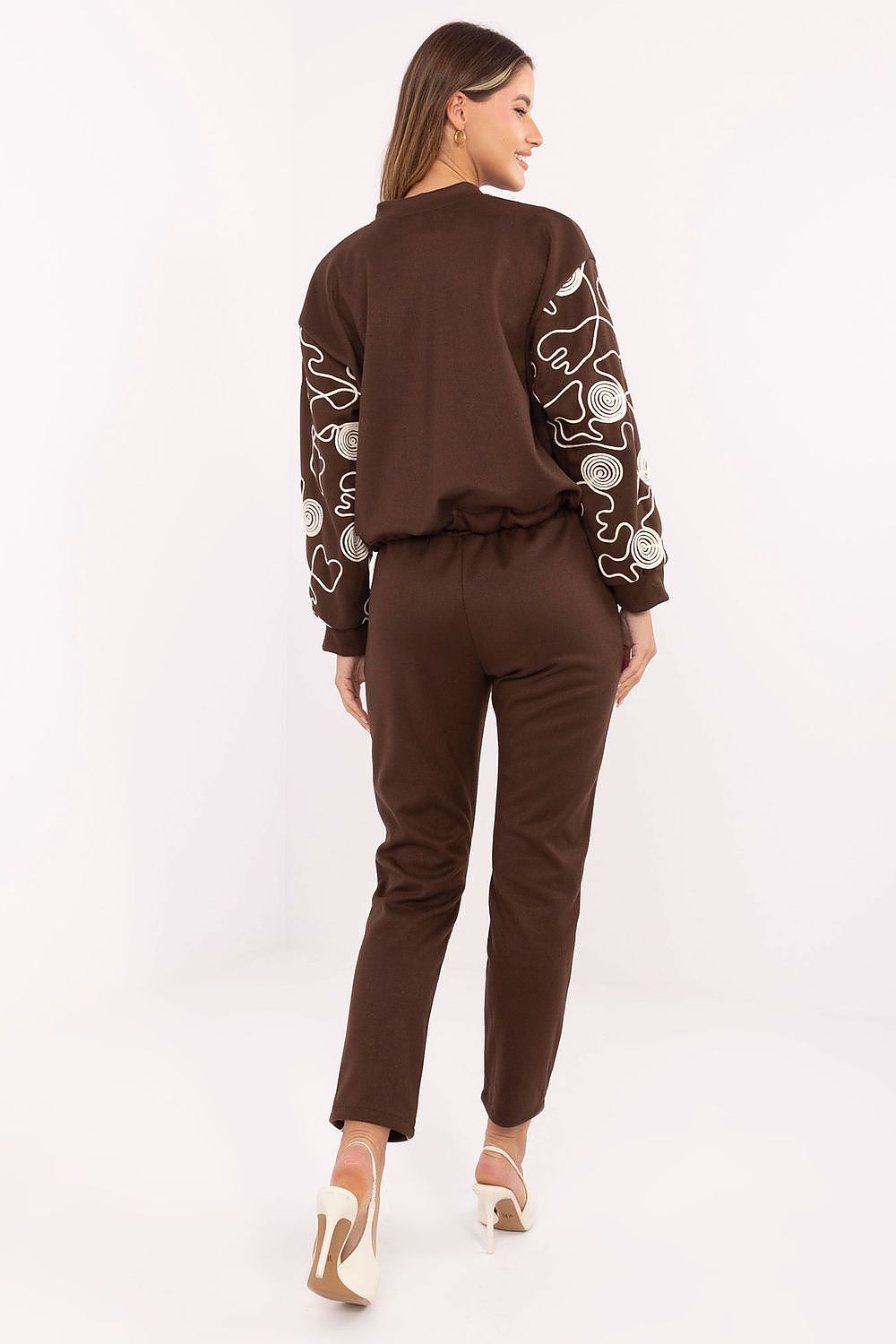 Full view of the Italy Moda women's tracksuit set, elegantly styled with a zip-up hoodie and tapered pants for a chic, modern aesthetic.