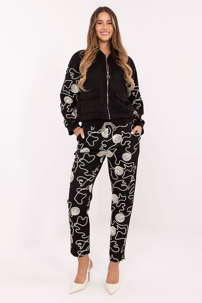 Detailed view of the embroidery on Italy Moda women's tracksuit, capturing the luxurious design elements that add character and style.