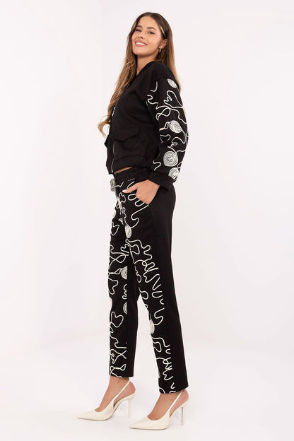 Italy Moda luxurious women's tracksuit set featuring a stylish zip-up hoodie with unique embroidery and tapered pants, designed for comfort and elegance.