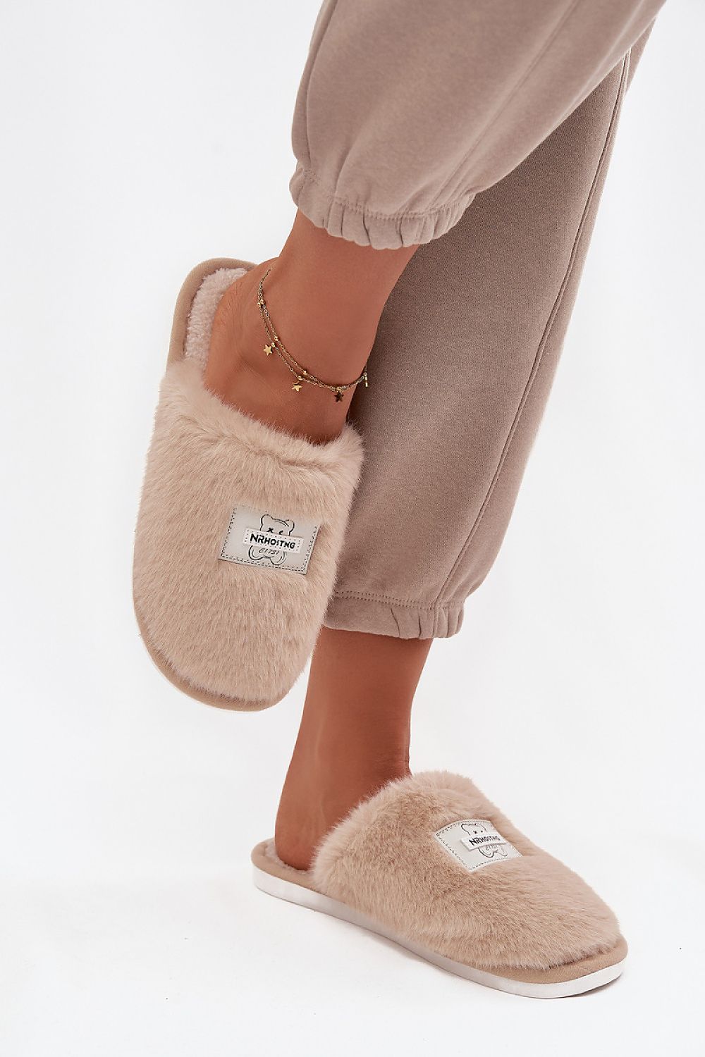 Luxury women’s fur slippers with bear motif by Step in style, showcasing a cozy and stylish design perfect for cold days.