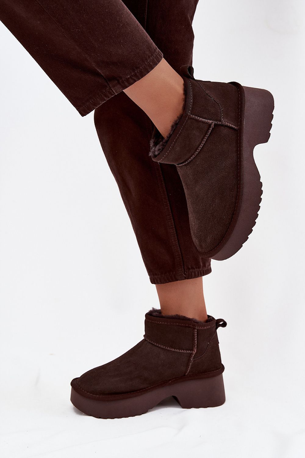 Elegant luxury women's suede snow boots by Step in Style, highlighting the chic platform design and premium fur lining, ideal for cold weather.