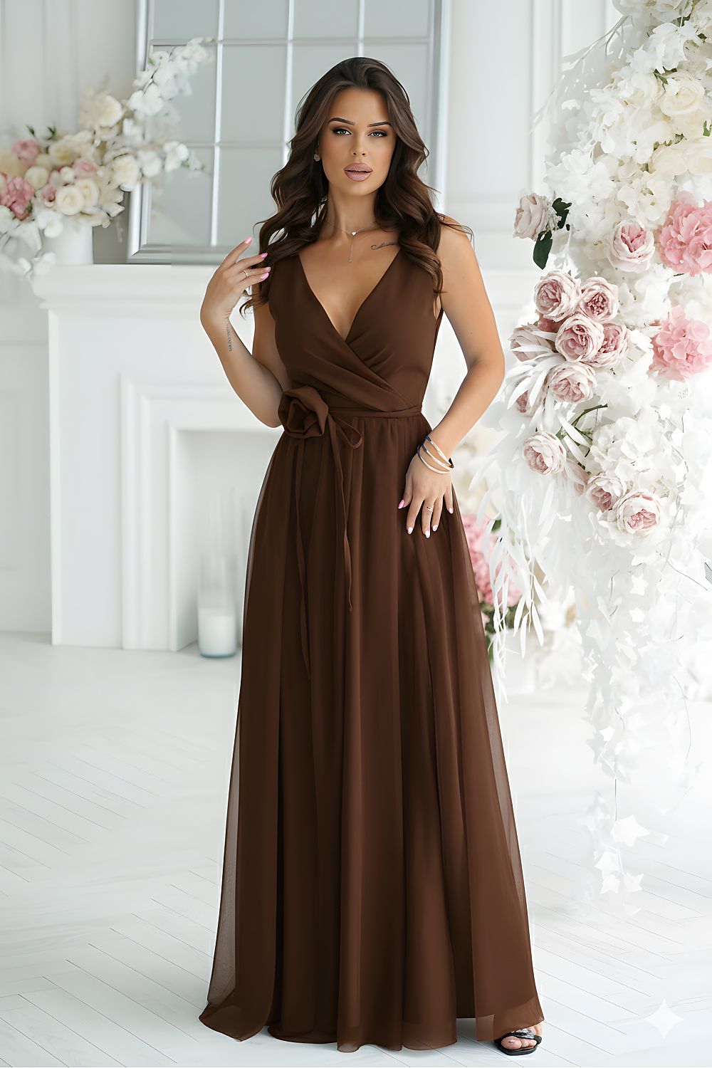 Elegant long dress by Bicotone in flowing fabric with stylish slit detail, showcasing a lavish silhouette and luxurious design.