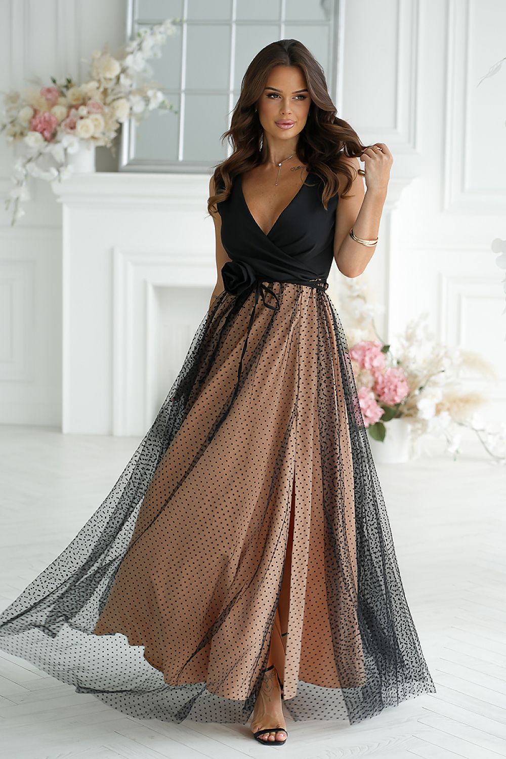 Elegant long dress by Bicotone featuring an airy fabric and unique cut, ideal for enhancing your silhouette.