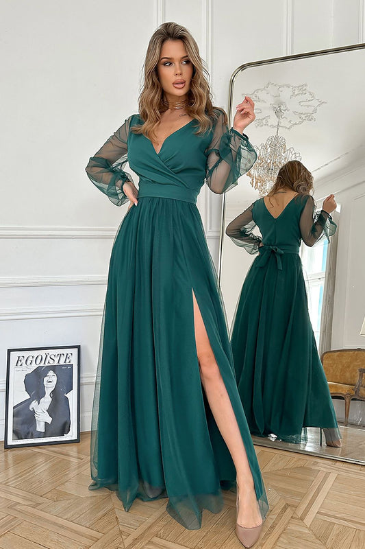 Elegant Bicotone long dress with a slit and belt, showcasing flowing fabric and sophisticated design, perfect for special occasions.