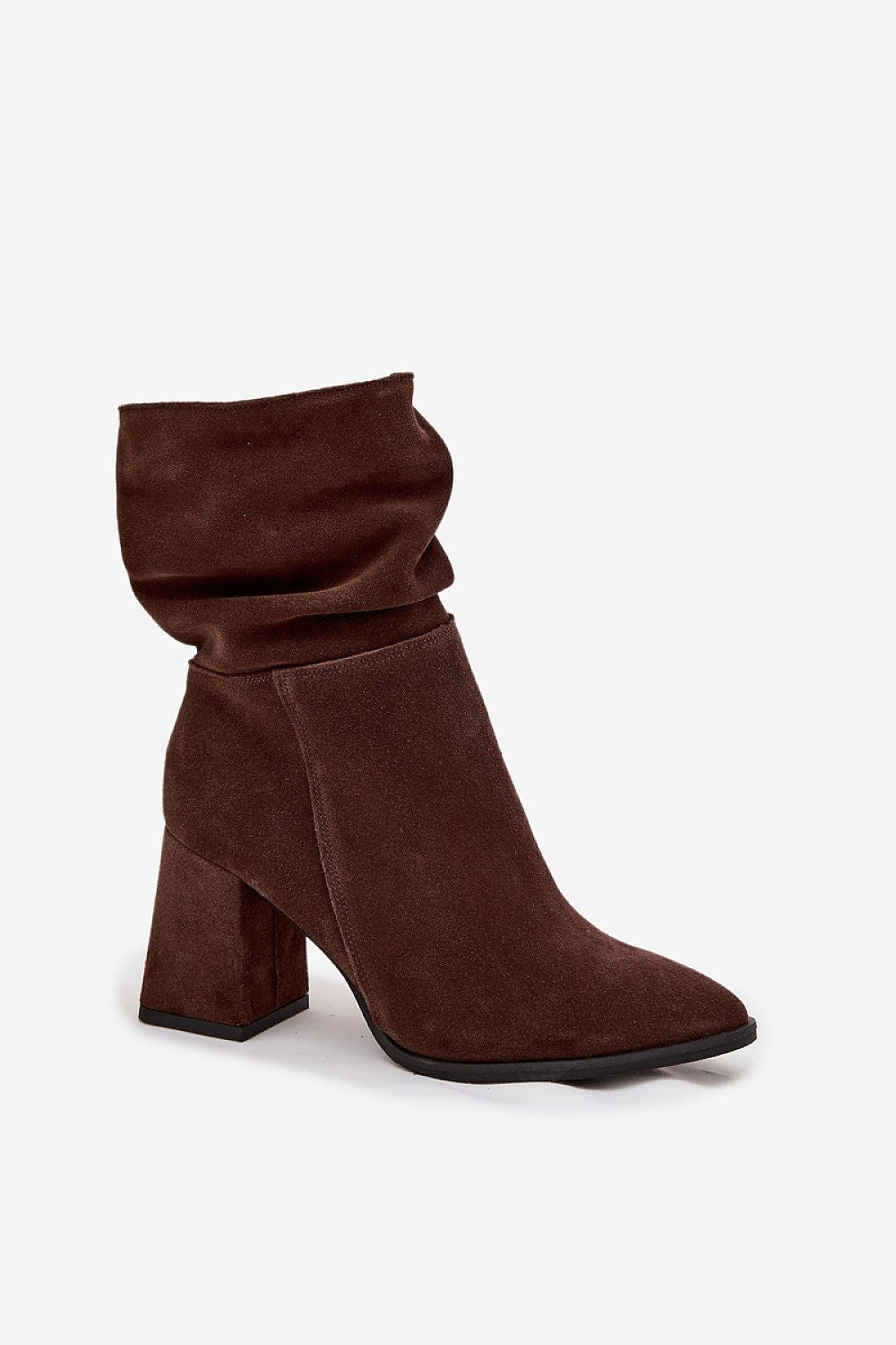 Close-up of Step in Style suede ankle boots for women with a stable column heel, almond-shaped toes, and felt lining for optimal warmth and comfort.
