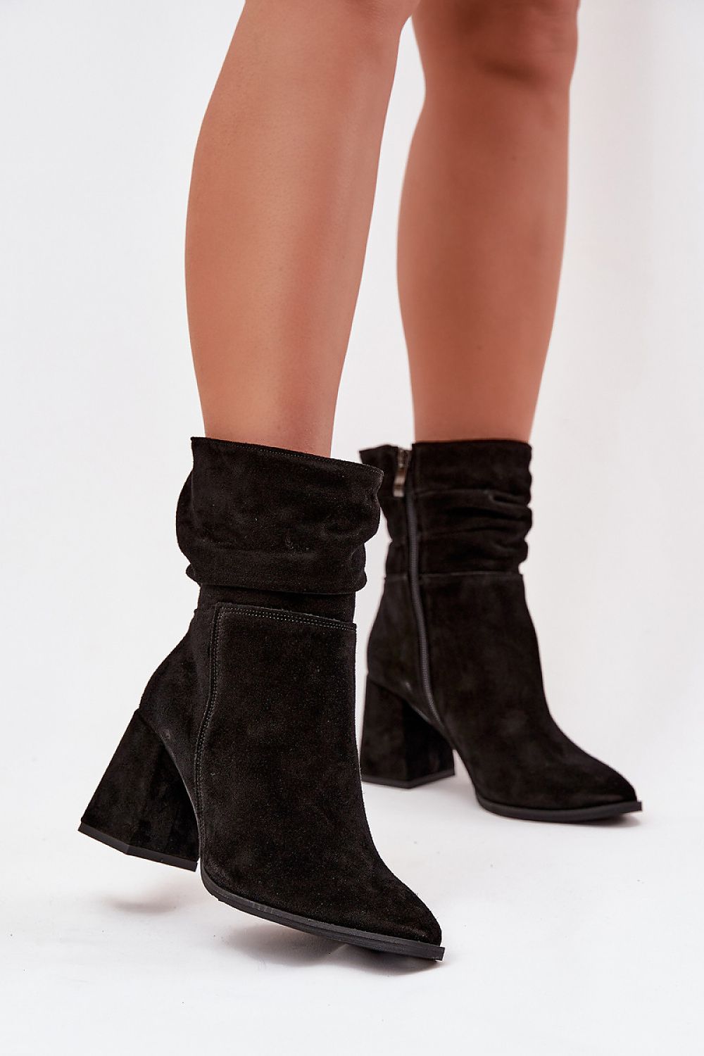 Elegant women's suede ankle boots with column heel and felt lining by Step in Style, featuring a stable heel for comfort, stylish almond toes, and a side zipper for easy wear, available in sizes EU 35-41.