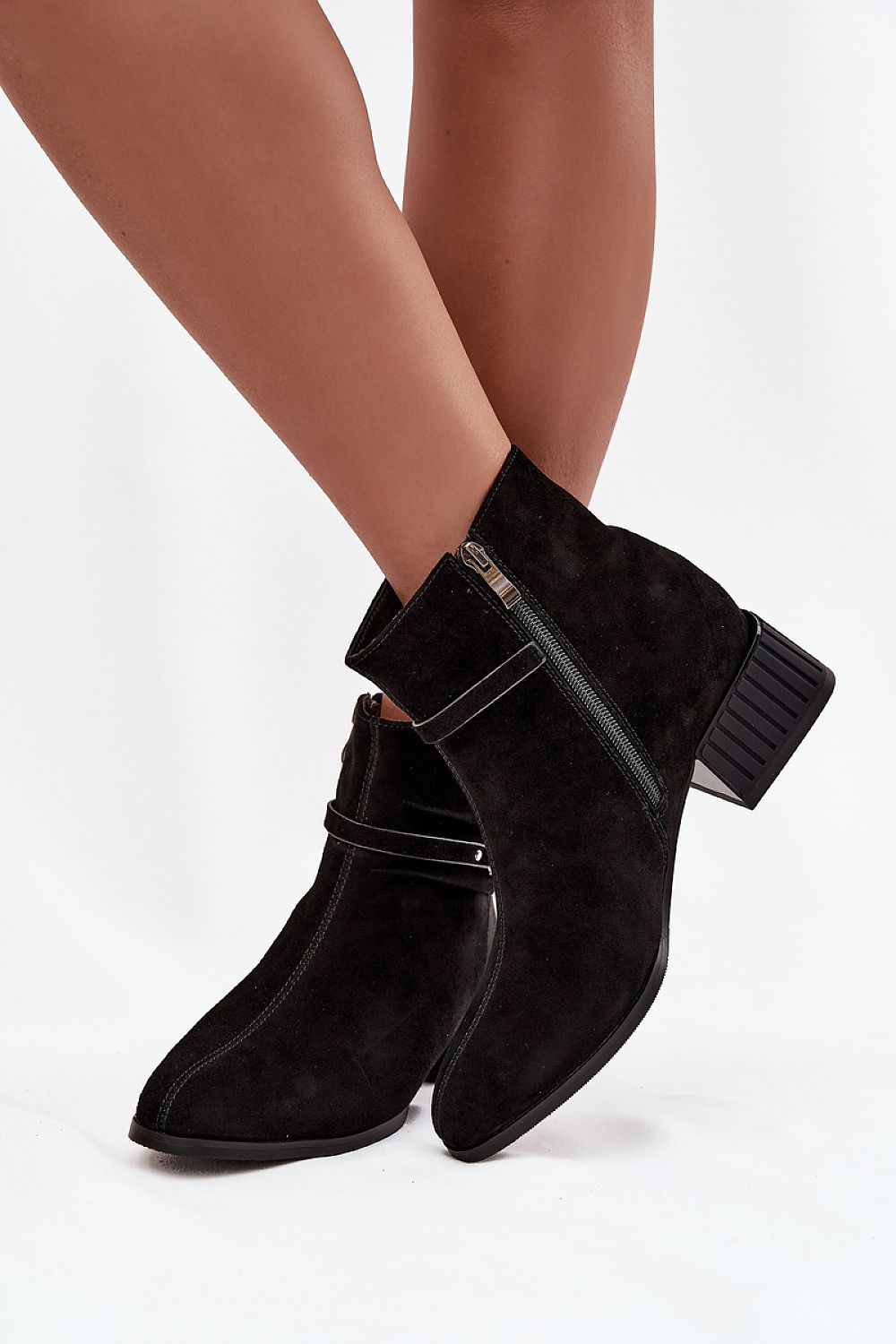Elegant women's suede ankle boots with a block heel, designed by Step in Style, featuring a stylish zipper and decorative strap, perfect for chic everyday wear.