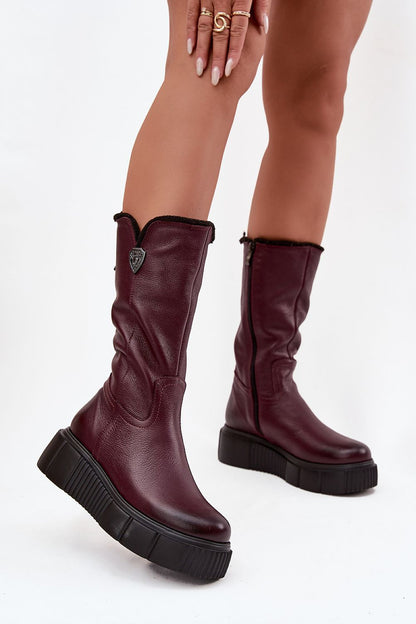 Luxury women's thigh-high leather boots with wool lining by Step in Style, featuring a wedge platform heel and decorative elements, perfect for winter elegance.