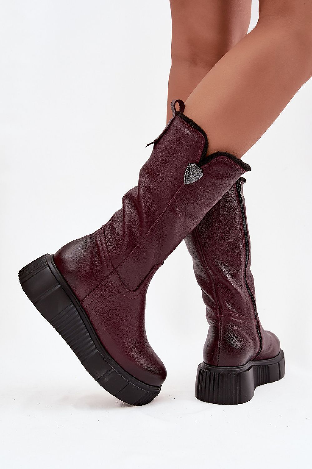 Close-up of luxury women's thigh-high leather boots by Step in Style, highlighting the sturdy platform and wedge heel, crafted for ultimate comfort and style in cold weather.