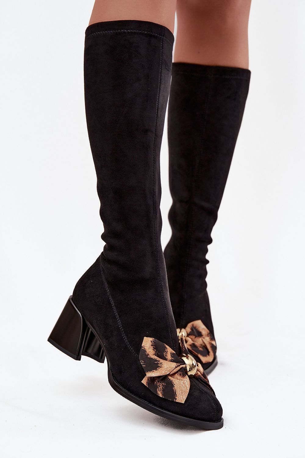 Sleek profile of Step in style women's eco-suede heel boots, highlighting their sophisticated look ideal for elegant outfits.