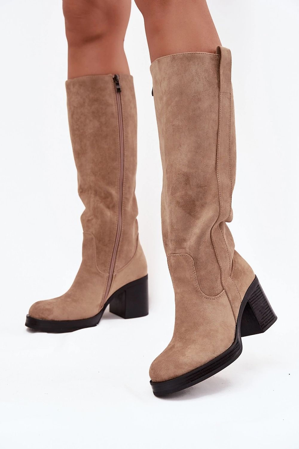 Step in Style's luxury women's boots crafted from eco-suede, showcasing a sophisticated rounded toe and a practical zipper closure for effortless elegance.