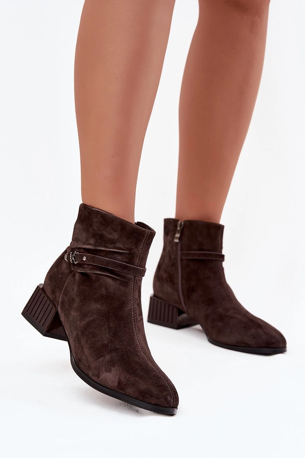 Trendy women's ankle boots made of natural suede with decorative strap and stitching, ideal for enhancing elegance in everyday outfits, designed by Step in Style.