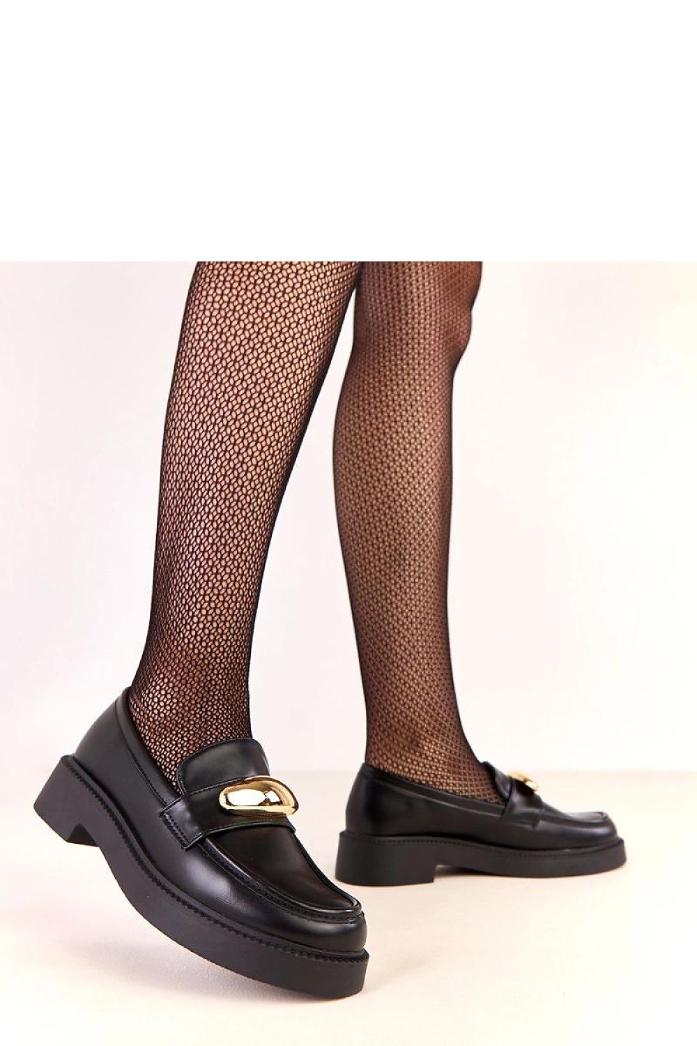 Close-up view of Solea Elegant Vegan Leather Loafers highlighting the subtle gold decoration on the front, symbolizing feminine elegance.