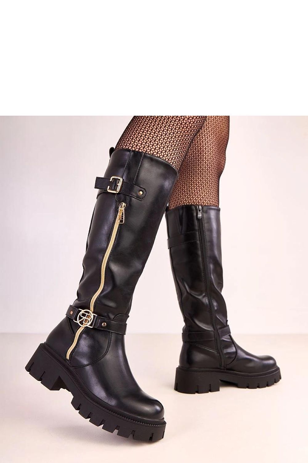Luxurious knee-high boots from Solea made of high-quality vegan leather, showcasing a modern design with gold accents and a comfortable rounded toe.