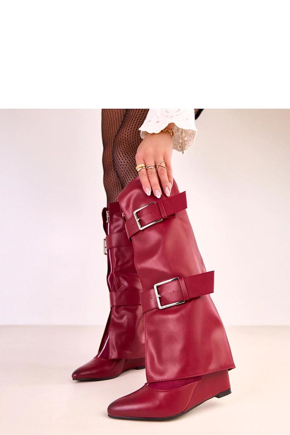 Luxurious Solea knee-high boots with pointed toe design and comfortable interior insulation for warmth on cooler days.