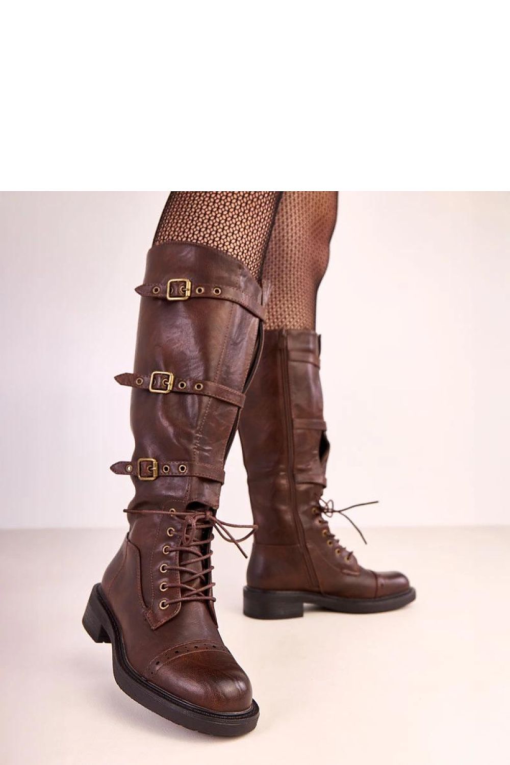Luxury vintage-inspired knee-high vegan leather boots by Solea featuring decorative straps and buckles, designed for stylish comfort in cold weather.