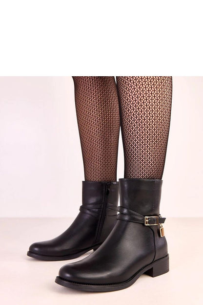 Elegant Solea ankle boots featuring a decorative buckle, crafted from high-quality faux leather, perfect for sophisticated autumn-winter styles.