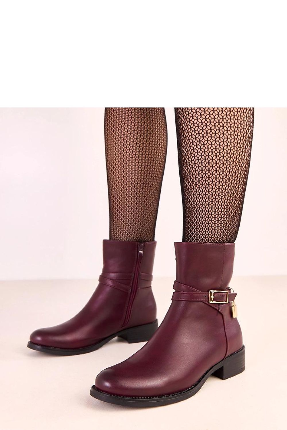 Elegantly designed Solea vegan leather ankle boots featuring a decorative buckle and side lock, showcasing a pointed toe and 3cm heel, perfect for autumn-winter fashion.