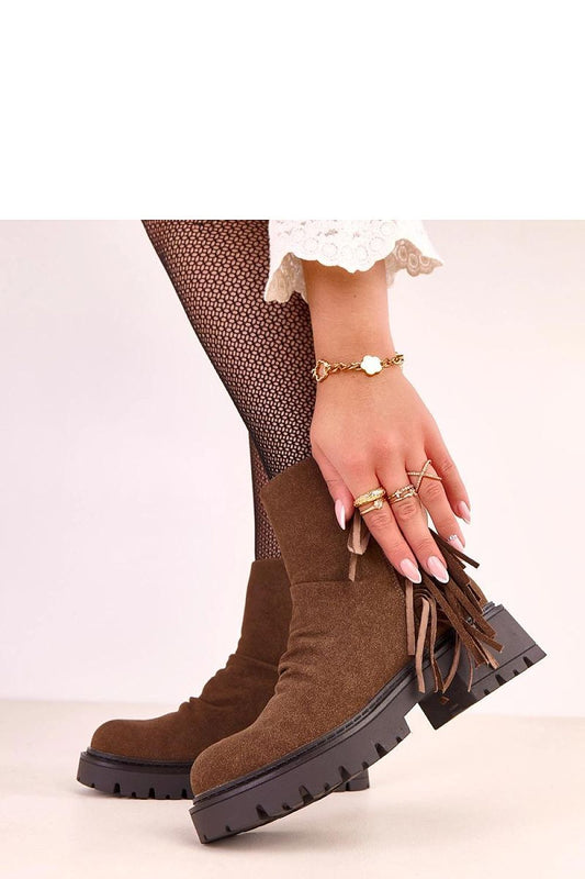 Elegant Solea Ankle Boots with a comfortable round toe, thick sole, and stylish silhouette, designed for sophistication and warmth in colder climates.