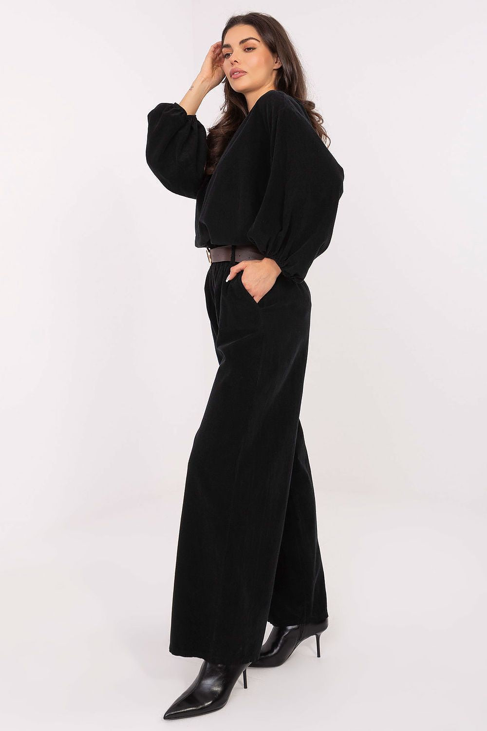 Close-up detail of Italy Moda's luxurious high-waisted wide leg corduroy trousers, showcasing the soft polyester fabric and practical side pockets.