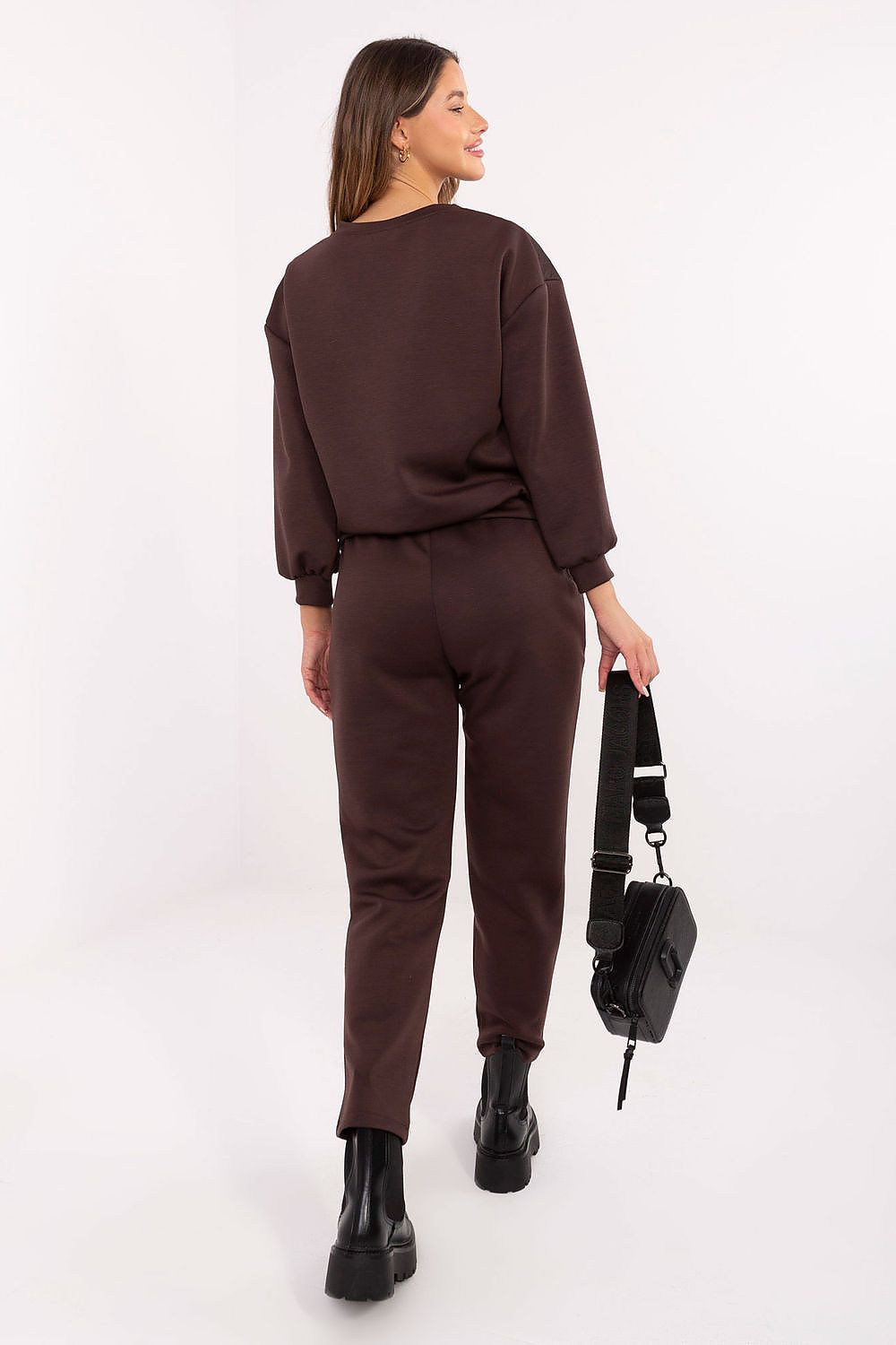 Side view of Italy Moda Women's high-waisted trousers in EU 0, designed for comfort with tapered legs and side slip pockets.