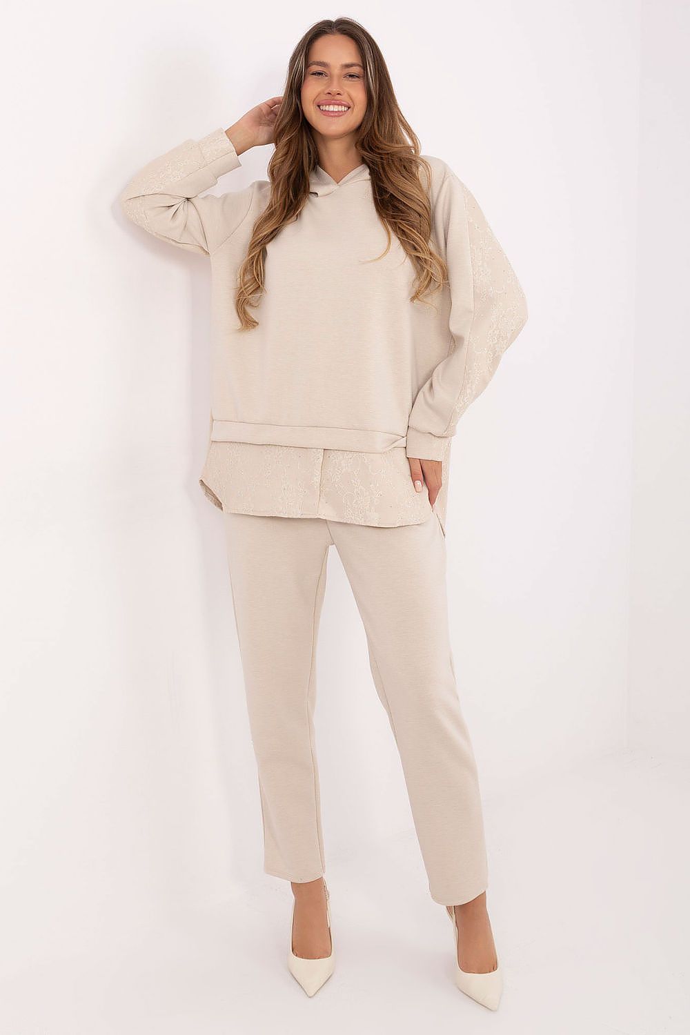 Luxury women's hoodie and trousers set from Italy Moda, crafted from a soft viscose-elastane blend, featuring elegant lace inserts and decorative jets.