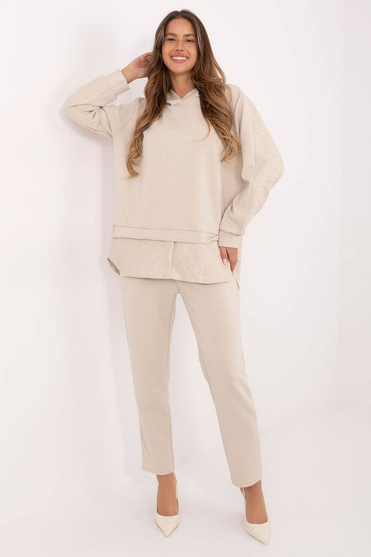 Luxury women's hoodie and trousers set from Italy Moda, crafted from a soft viscose-elastane blend, featuring elegant lace inserts and decorative jets.