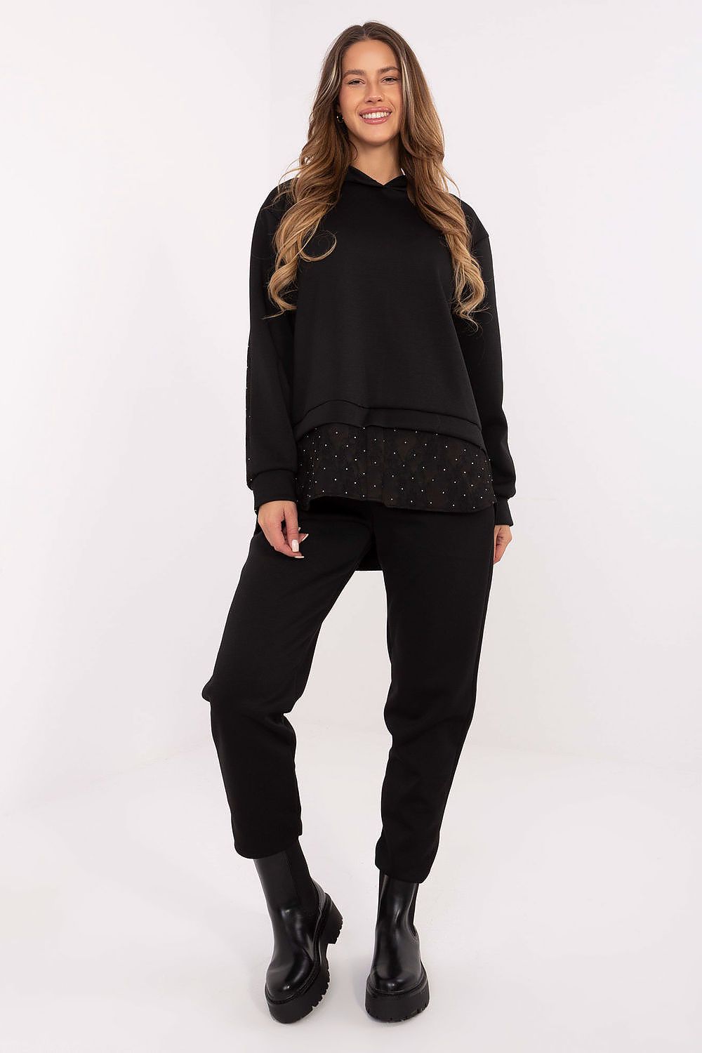 Elegant women's casual set by Italy Moda featuring a stylish hoodie with decorative jet stones and lace details, paired with tapered pants for comfortable everyday wear.