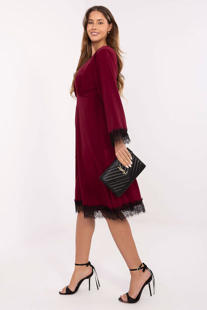 Stylish flared midi dress by Italy Moda, showcasing long sleeves and exquisite lace finishes, embodying a blend of comfort and luxury.