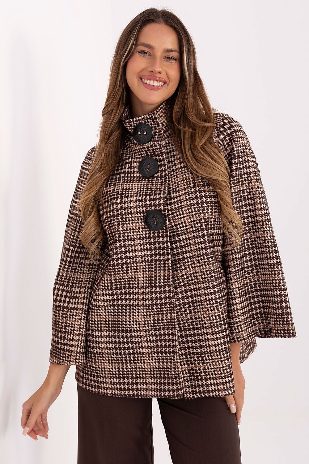 Luxurious checkered women's coat by Italy Moda, crafted from high-quality polyester blend. This elegant standard length coat features a stylish design with a stand-up collar and large button fastening, perfect for both casual and refined outfits.