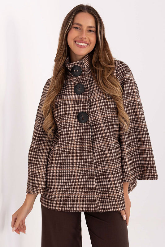 Luxurious checkered women's coat by Italy Moda, crafted from high-quality polyester blend. This elegant standard length coat features a stylish design with a stand-up collar and large button fastening, perfect for both casual and refined outfits.