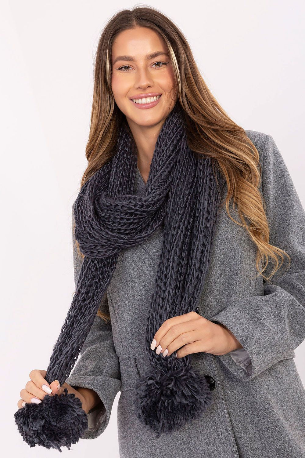 High-quality soft acrylic scarf with adorable pompons from AT, designed for warmth and fashionable winter styling.
