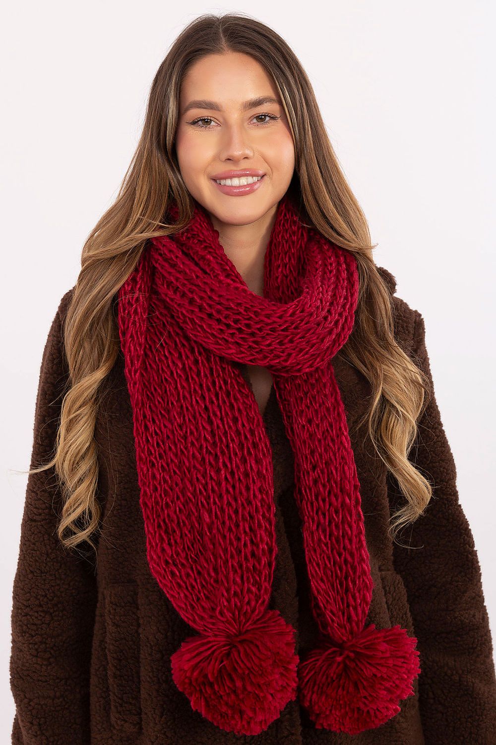 Luxurious 100% acrylic shawl scarf by AT, featuring adorable pompoms and designed for winter elegance. Ideal for stylish layering.