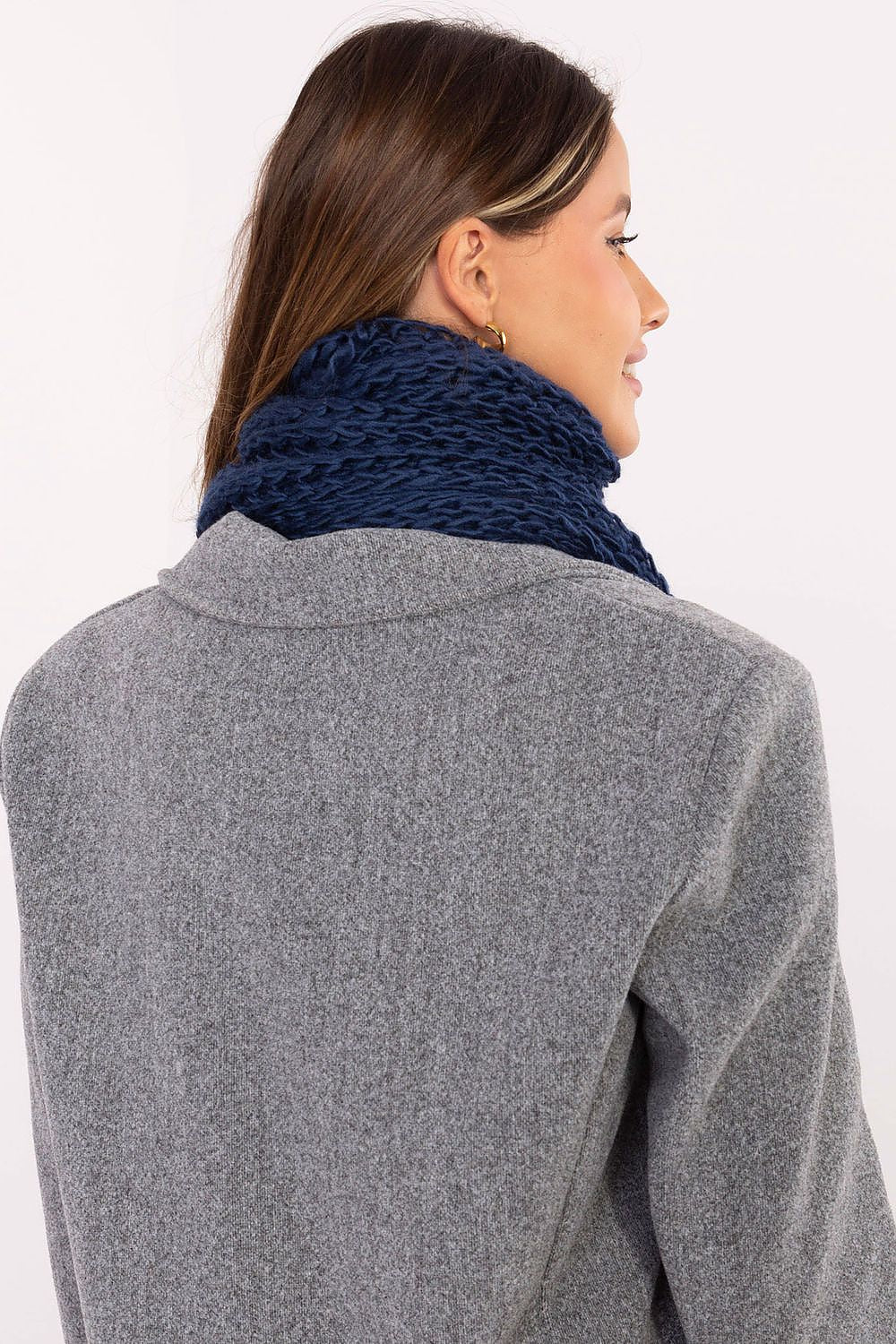 Cozy high-quality acrylic scarf with pom poms by AT, showcasing its smooth texture and versatile styling options for cold winter days.