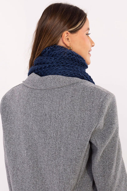 Cozy high-quality acrylic scarf with pom poms by AT, showcasing its smooth texture and versatile styling options for cold winter days.