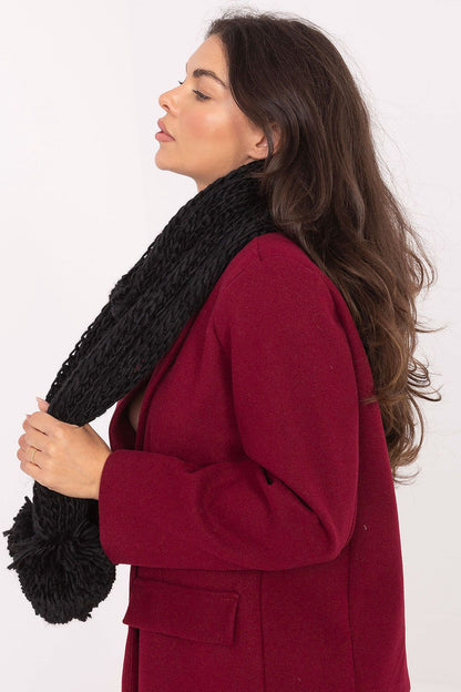 Cozy acrylic scarf by AT, featuring cute pompoms, elegant design ideal for cold weather outfits.