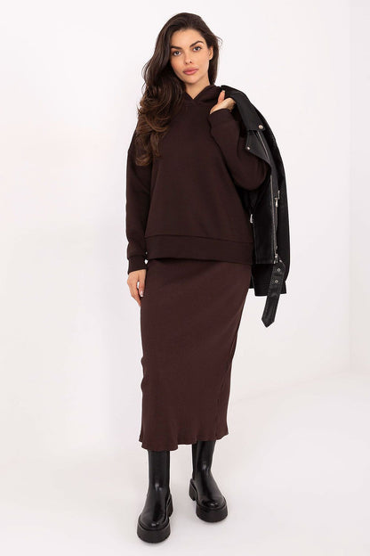 Stylish midi-length knitted skirt with slit by Relevance, crafted from cotton and spandex for a comfortable fit, showcasing elegance in casual fashion.