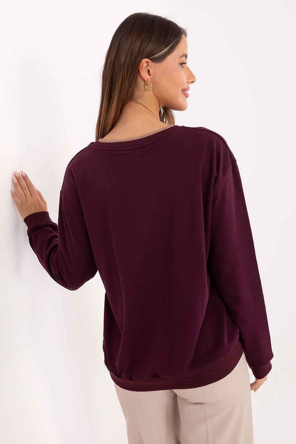 Fashion-forward women's sweatshirt by Relevance, designed with embroidered details and perfect for pairing with jeans or leggings, combining style and comfort effortlessly.