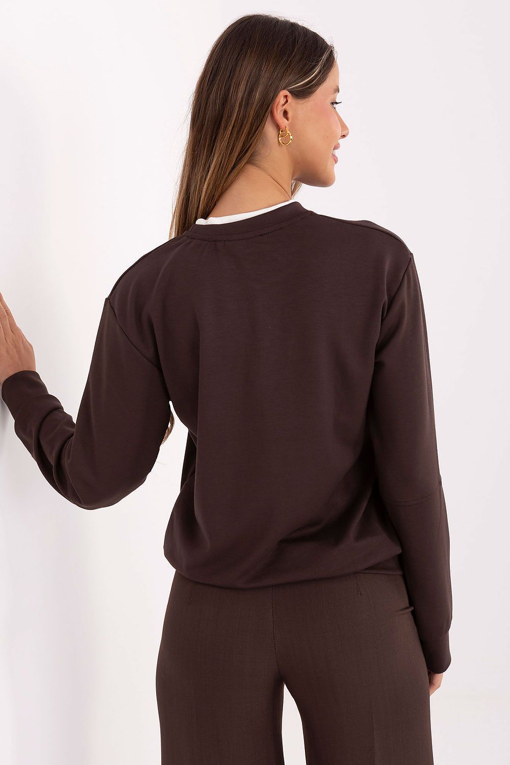 Relevance women's blouse in EU size 0, showcasing an elegant design with brooches, ideal for pairing with jeans or skirts.