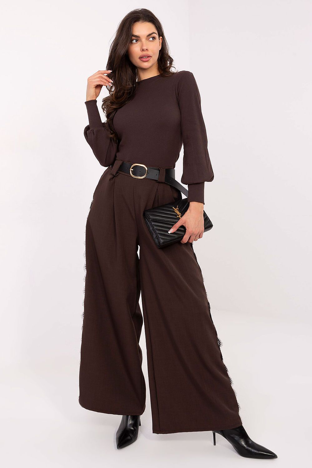 Close-up of Rue Paris Ribbed Turtleneck Blouse, featuring luxurious ribbed fabric and wide cuffs, ideal for chic layering.