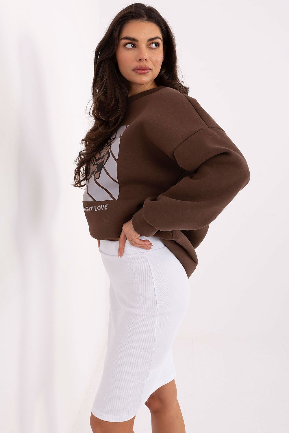 Chic ribbed knit skirt in solid colour by Rue Paris, perfect for layering and creating timeless outfits.