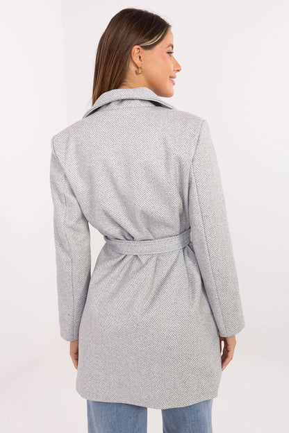 Model showcasing the Rue Paris mid-thigh coat with a chic belt and slip pockets, ideal for both casual and formal occasions.