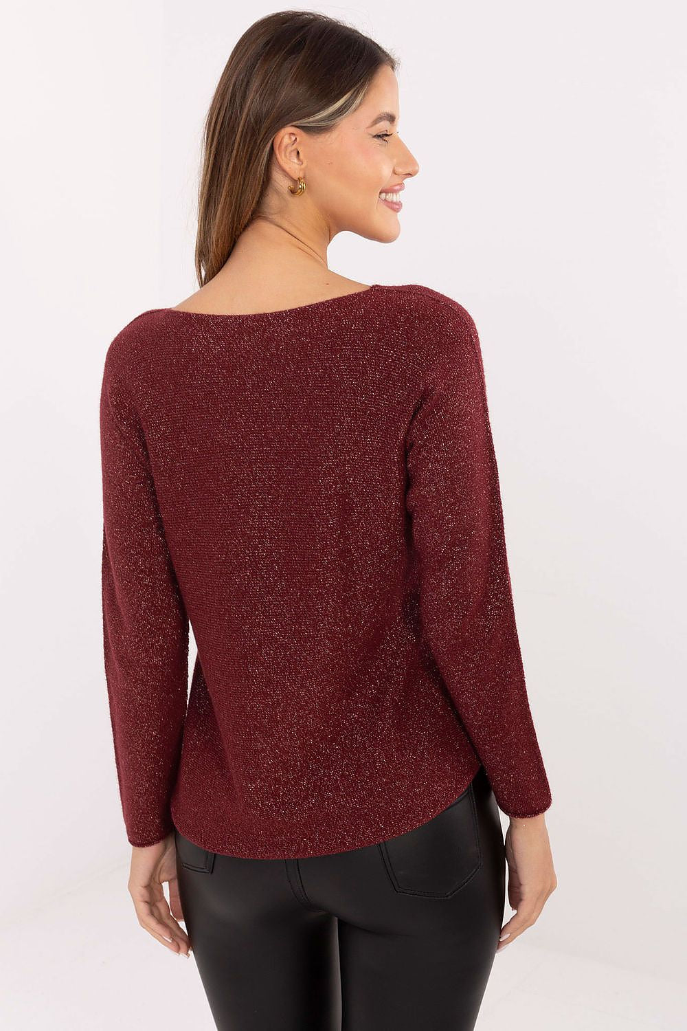 Model wearing Rue Paris elegant women's sequin sweater, demonstrating versatility for both casual and evening wear.