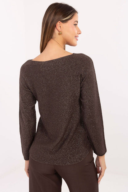 Model wearing elegant women's lurex sweater by Rue Paris, styled with trousers, illustrating versatility and sophistication suitable for both day and evening occasions.