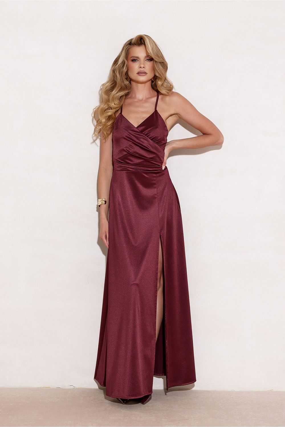 Elegant flowy maxi dress with slit by Roco Fashion, beautifully designed with thin straps and a wrapped top, perfect for a stylish evening out.