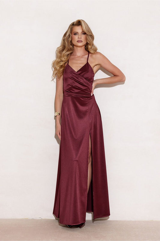 Elegant flowy maxi dress with slit by Roco Fashion, beautifully designed with thin straps and a wrapped top, perfect for a stylish evening out.