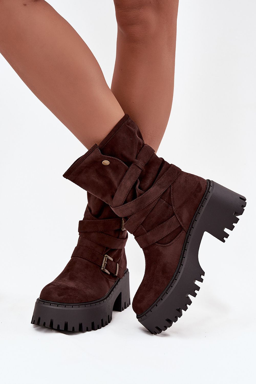 Sophisticated women's ankle boots with chunky heels by Step in Style, highlighting eco-friendly materials and a fashionable strap with gold buckles.